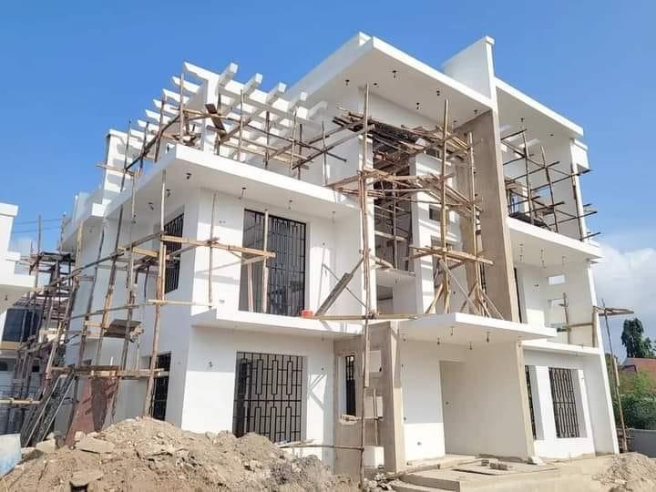Modern white residential building under construction