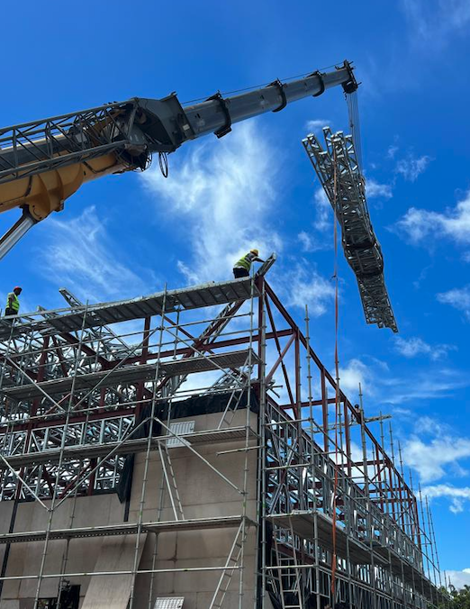 Construction site with crane and steel framework