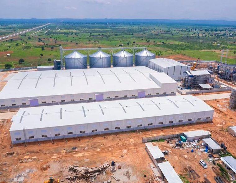 Aerial view of large industrial facility with steel warehouses